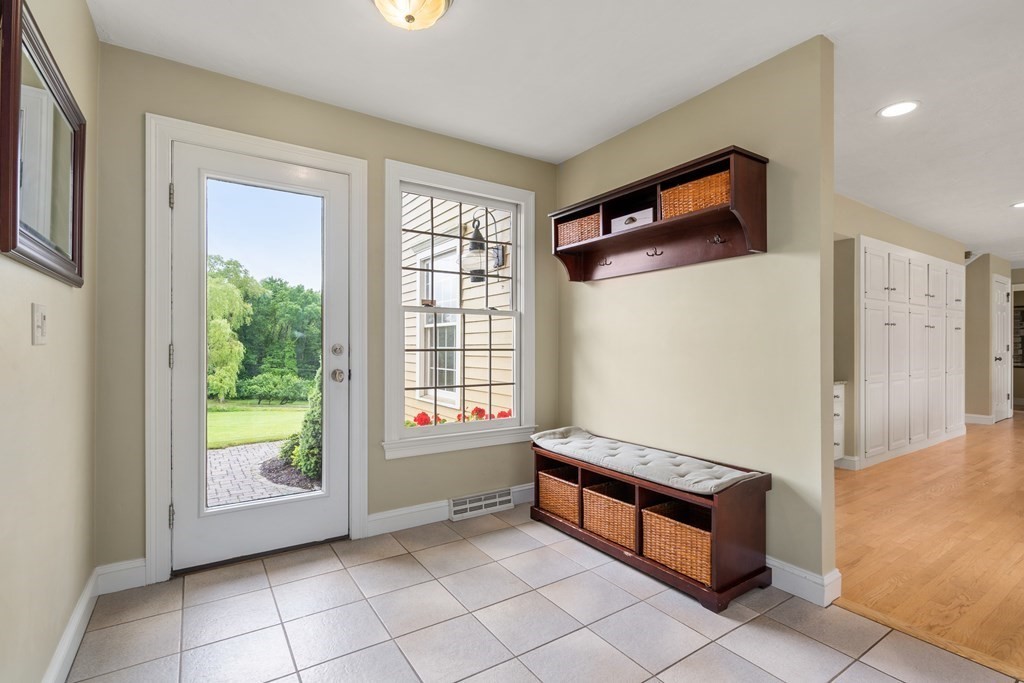 181 Maple Street Sherborn, MA 01770 - Photo 20 of 41 a spacious bedroom with a bed and a window