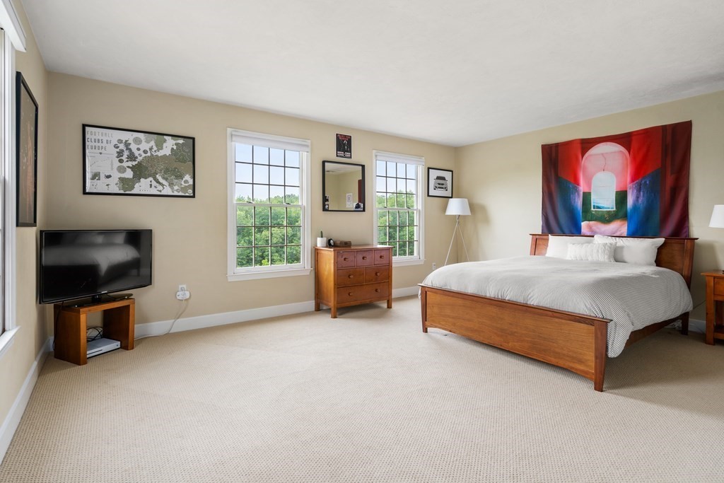 181 Maple Street Sherborn, MA 01770 - Photo 30 of 41 a bedroom with a bed a couch and dresser