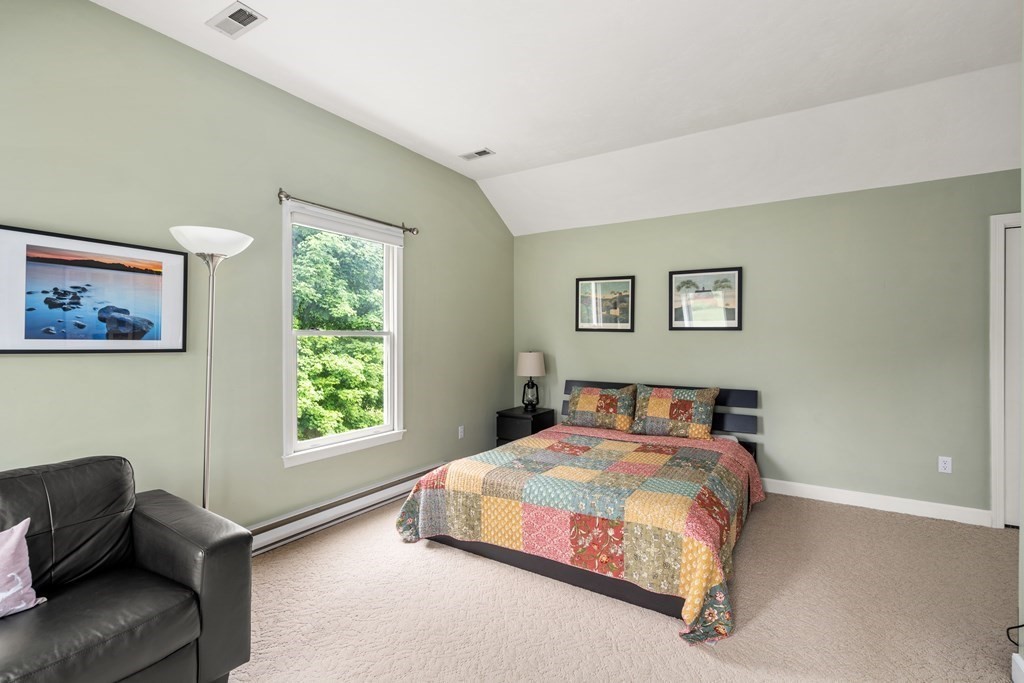 181 Maple Street Sherborn, MA 01770 - Photo 33 of 41 a bedroom with a bed and a couch