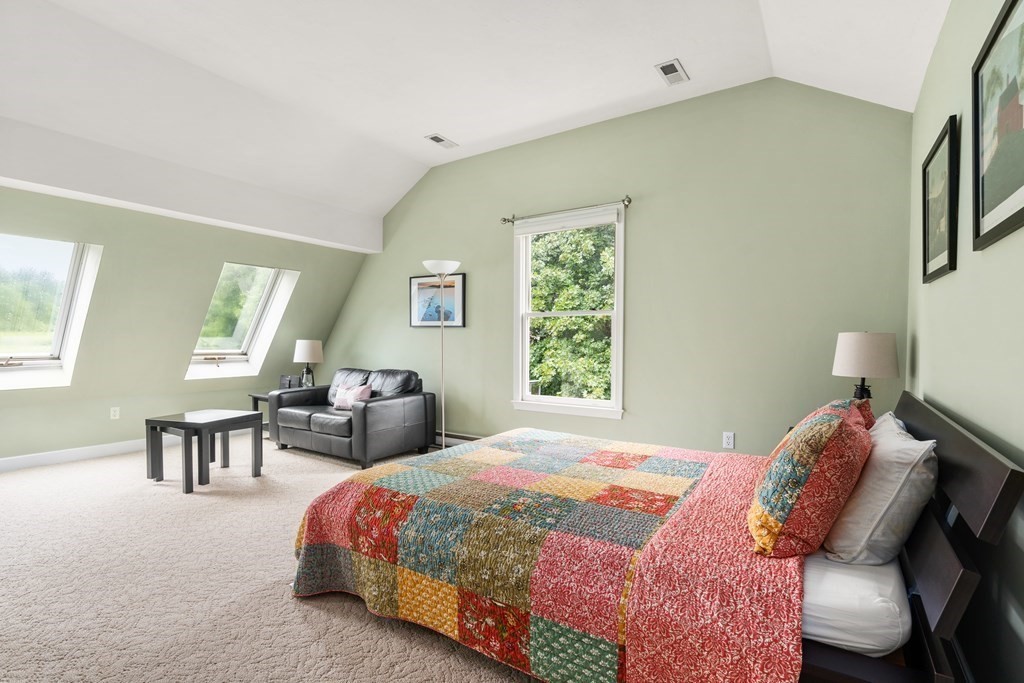 181 Maple Street Sherborn, MA 01770 - Photo 34 of 41 a bedroom with a bed and a table