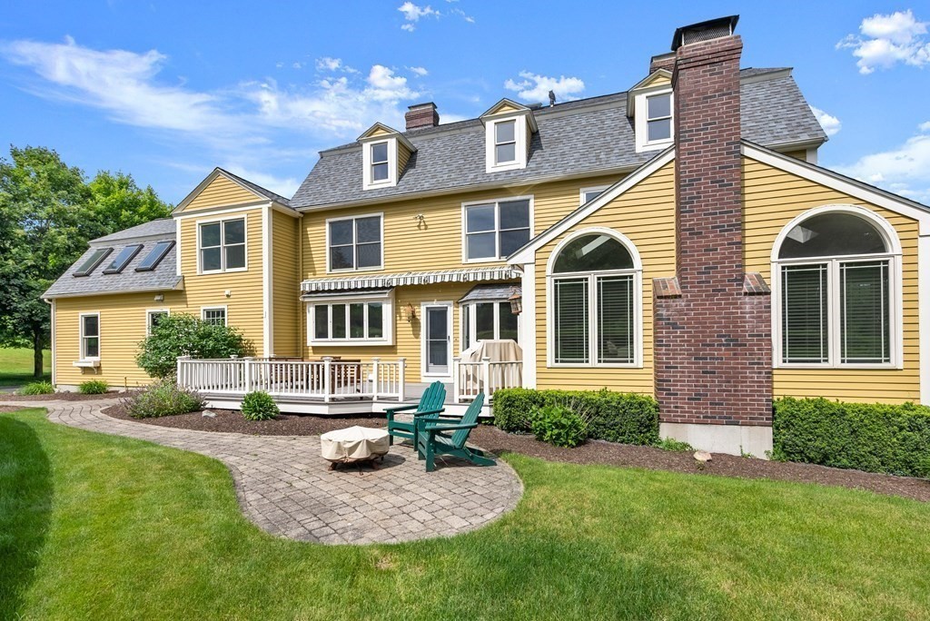 181 Maple Street Sherborn, MA 01770 - Photo 4 of 41 a front view of a house with yard and green space