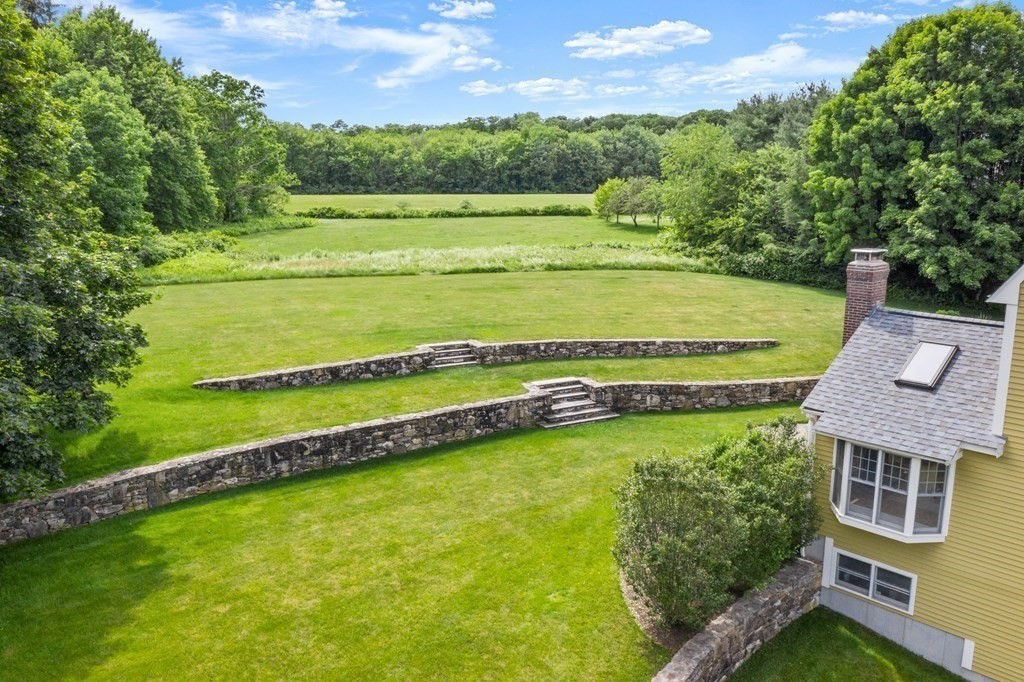 181 Maple Street Sherborn, MA 01770 - Photo 6 of 41 a view of a swimming pool with a yard