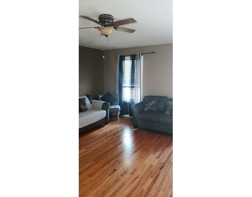 244 Russell Street Springfield, MA 01104 - Photo 2 of 9 a living room with furniture and a window