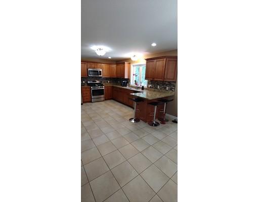 244 Russell Street Springfield, MA 01104 - Photo 3 of 9 a kitchen with a sink and a living room area