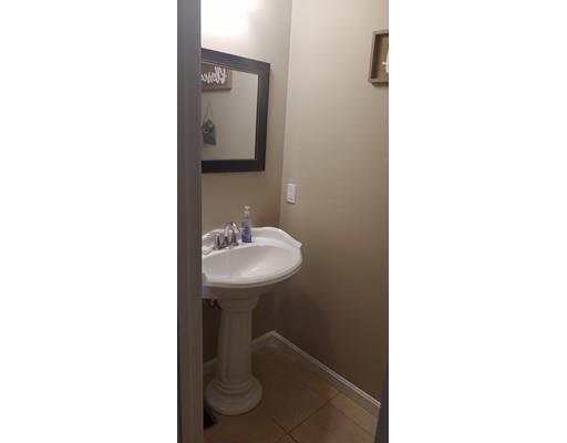 244 Russell Street Springfield, MA 01104 - Photo 5 of 9 a bathroom with a sink and a mirror
