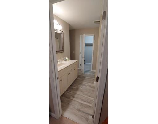 244 Russell Street Springfield, MA 01104 - Photo 7 of 9 a bathroom with a double vanity sink and mirror