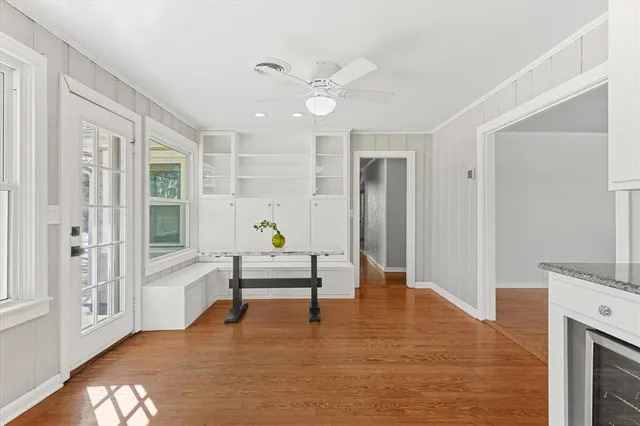a view of an entryway with wooden floor