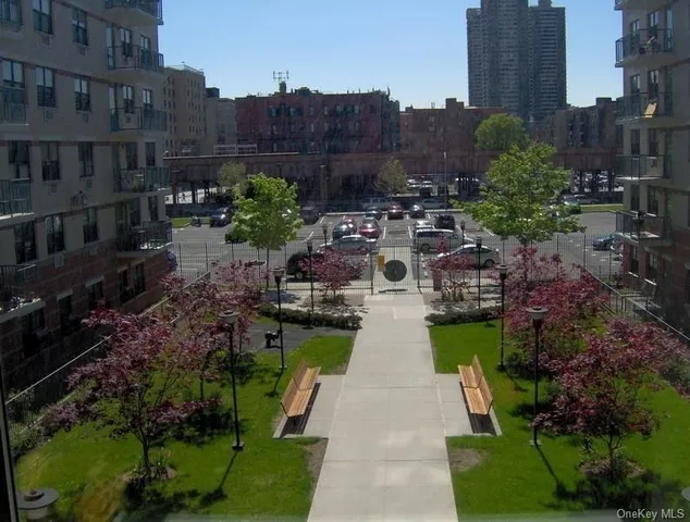a view of swimming pool with outdoor seating and plants