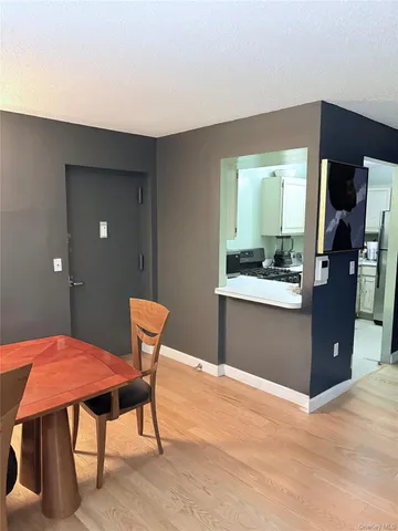 a dining room with a table and chairs