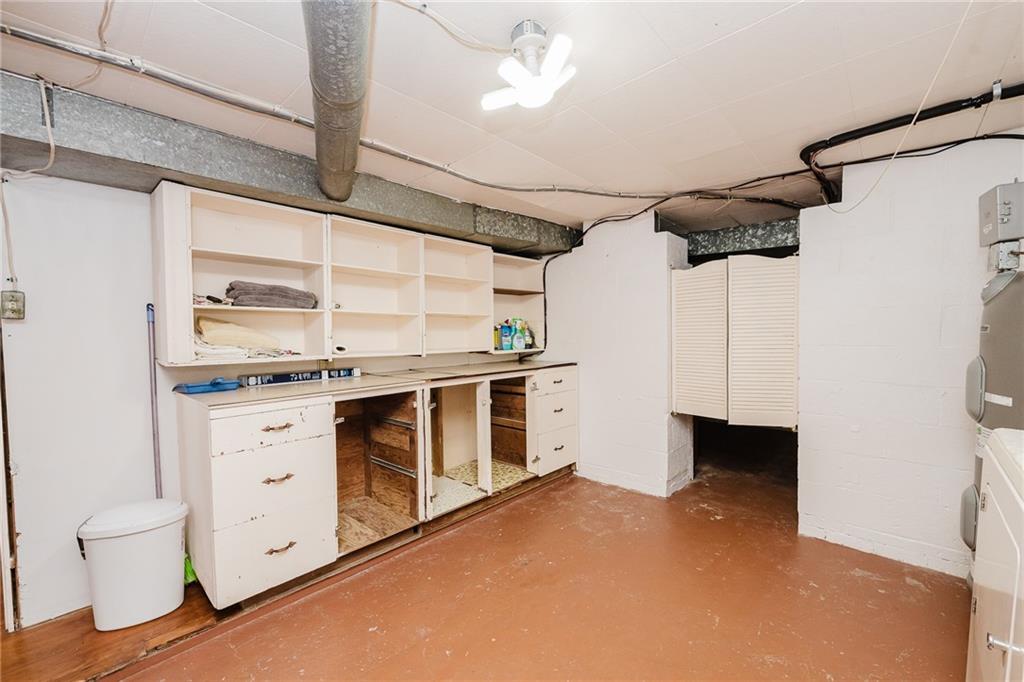 145 Hood School Road Indiana, PA 15701 - Photo 24 of 46 a open kitchen with white cabinets and white appliances