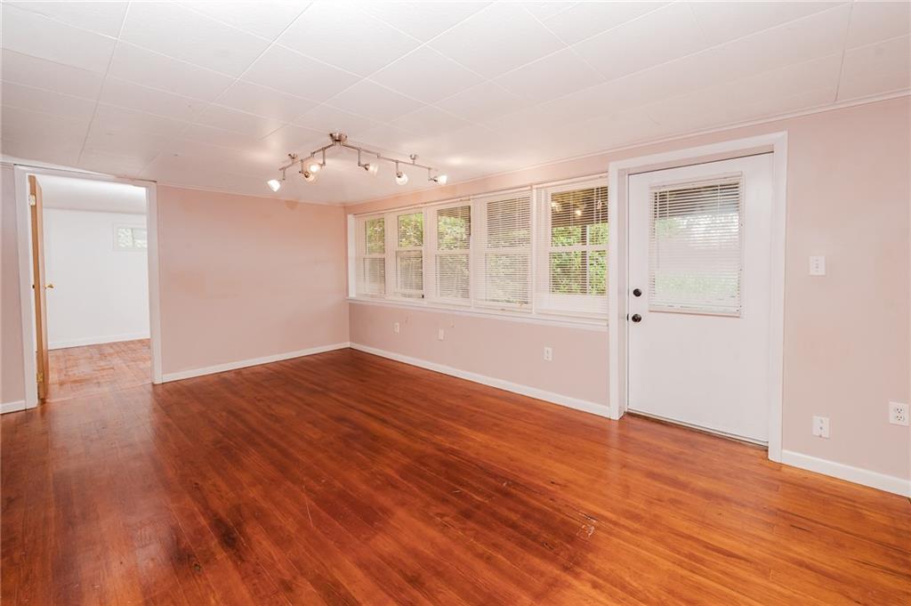 145 Hood School Road Indiana, PA 15701 - Photo 28 of 46 an empty room with wooden floor and windows