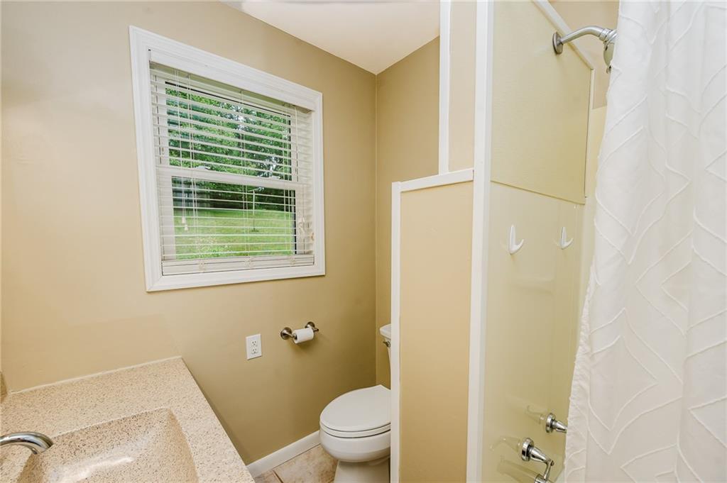 145 Hood School Road Indiana, PA 15701 - Photo 36 of 46 a bathroom with a granite countertop sink a toilet and shower