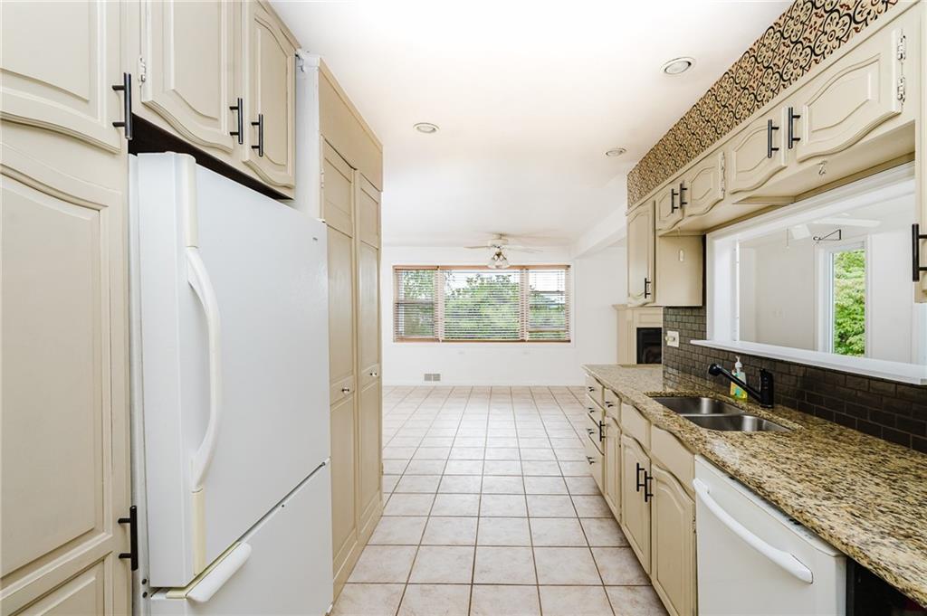 145 Hood School Road Indiana, PA 15701 - Photo 39 of 46 a kitchen with stainless steel appliances granite countertop a refrigerator and a sink