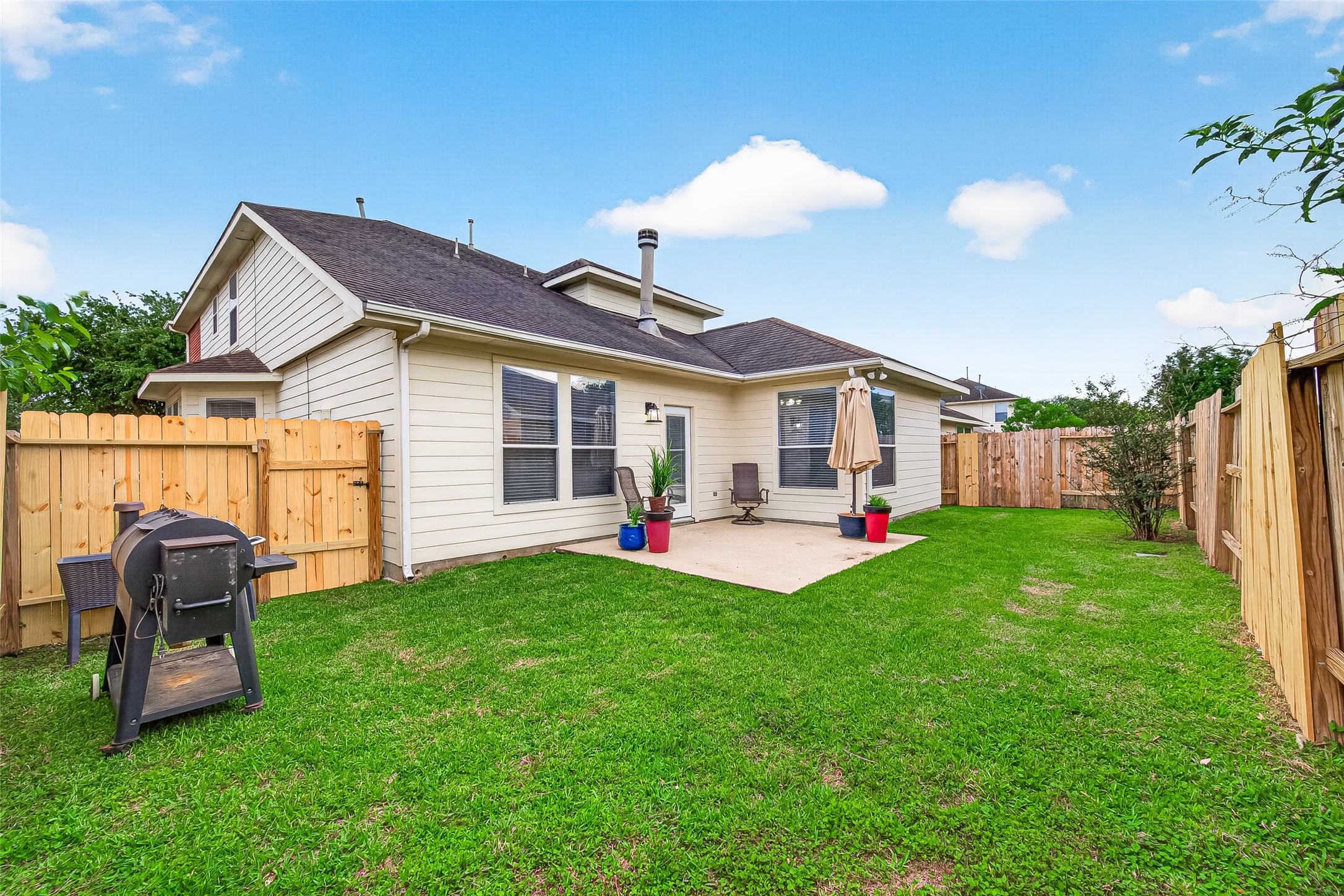 7415 Riven Oaks Court Cypress, TX 77433 - Photo 40 of 42 Expansive backyard with endless possibilities, perfect for hosting guests, outdoor activities, or designing the backyard oasis of your dreams.