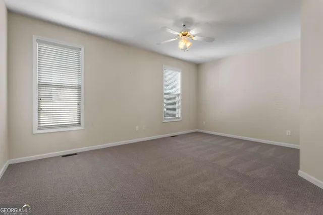 a bathroom with a bathtub and a window