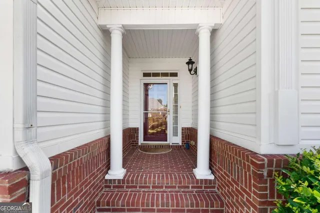 a view of a porch with wooden floor and stairs