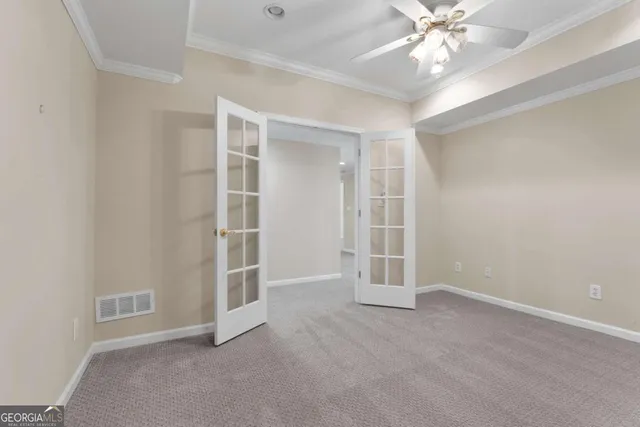 a view of a big house with a big yard and large trees
