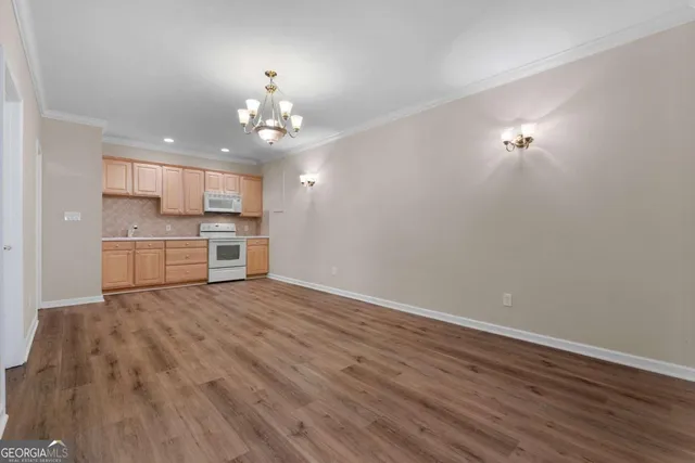 an aerial view of a house with a yard and garden
