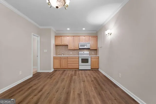 an aerial view of residential house with outdoor space and swimming pool