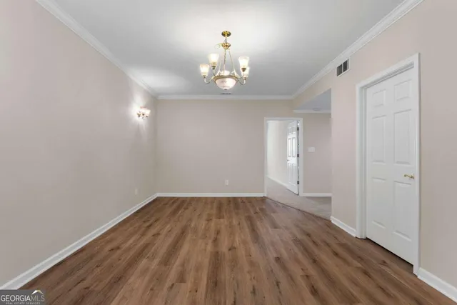 an aerial view of a house with garden space and street view
