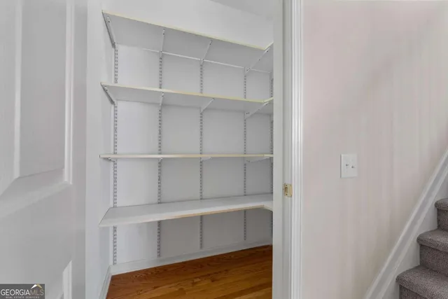 a view of an empty walk in closet