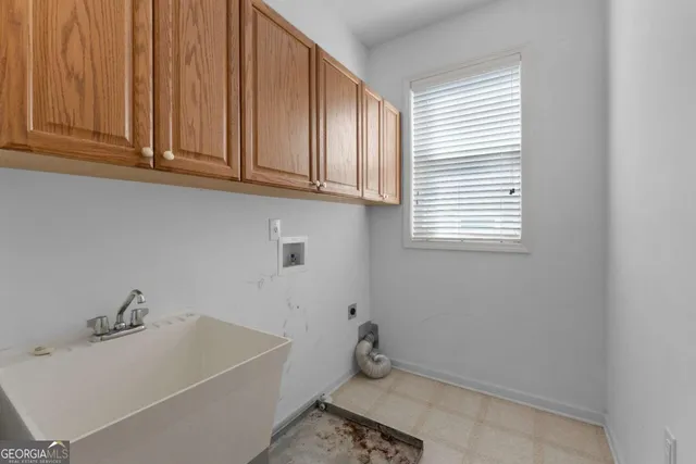 a bathroom with a bathtub and window