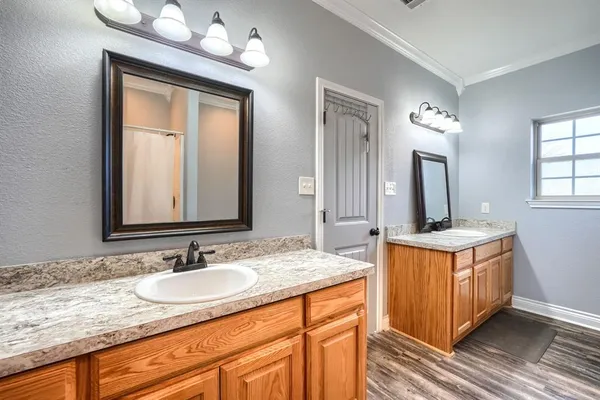 a bathroom with sinks granite countertop a sink and a mirror