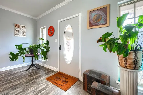 a view of a workspace with furniture and a potted plant