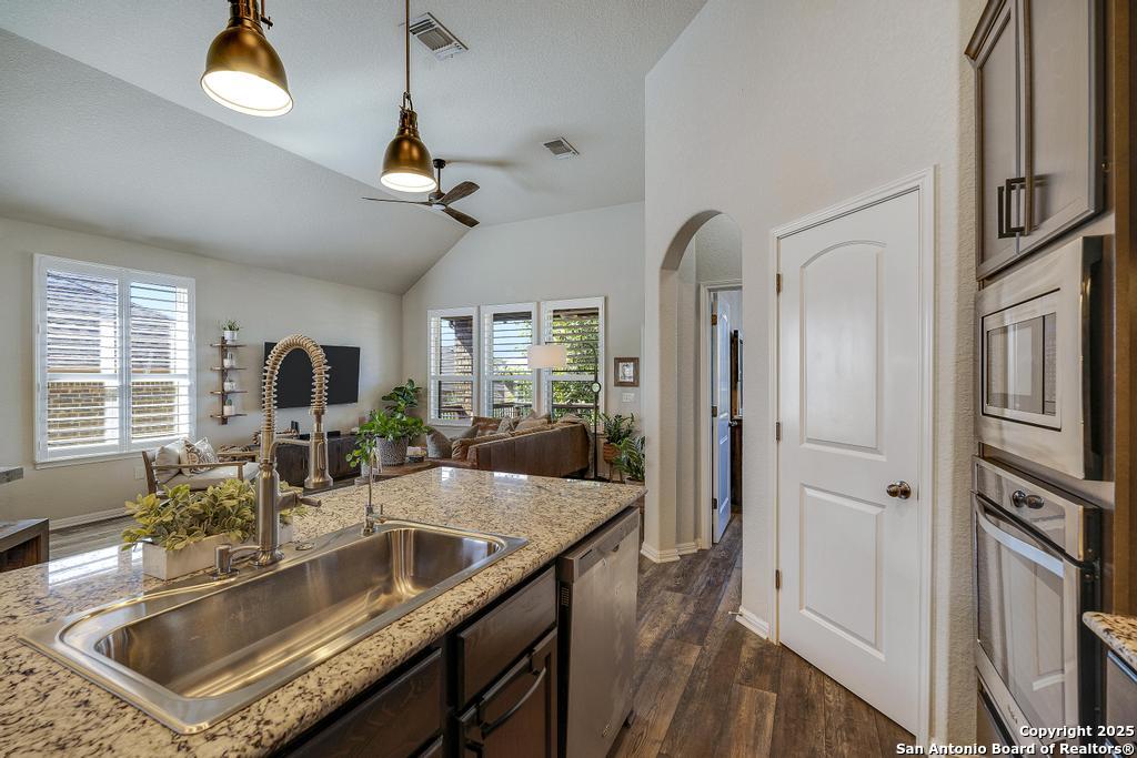 12805 Big Tank Ranch San Antonio, TX 78245 - Photo 13 of 35 a kitchen with sink refrigerator and window