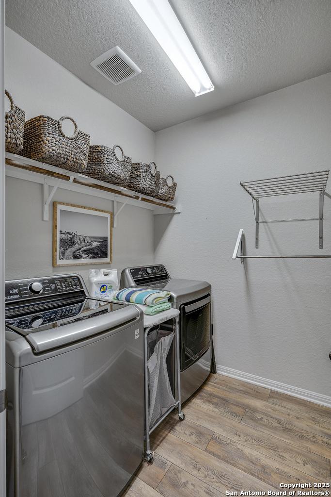 12805 Big Tank Ranch San Antonio, TX 78245 - Photo 25 of 35 a stove top oven sitting inside of a kitchen