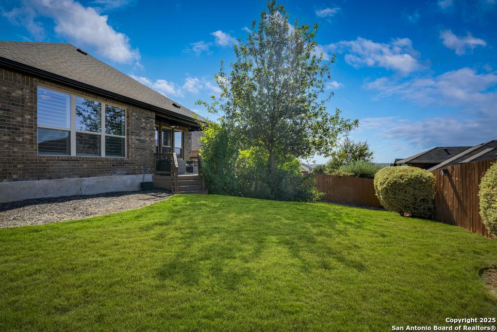 12805 Big Tank Ranch San Antonio, TX 78245 - Photo 30 of 35 a view of a backyard with plants and large tree