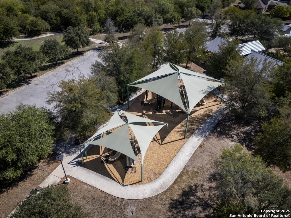 12805 Big Tank Ranch San Antonio, TX 78245 - Photo 35 of 35 an aerial view of a house with swimming pool and large trees