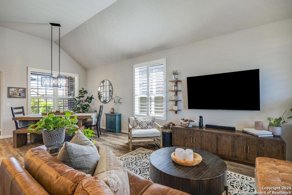 12805 Big Tank Ranch San Antonio, TX 78245 - Photo 6 of 35 a living room with furniture and a flat screen tv