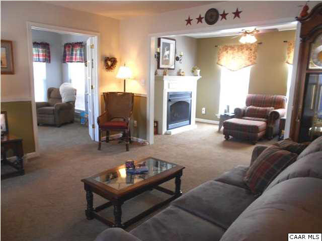 99 Cresmont Road Troy, VA 22974 - Photo 3 of 29 a living room with furniture and a fireplace
