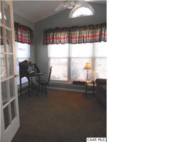 99 Cresmont Road Troy, VA 22974 - Photo 6 of 29 a living room with furniture and a large window
