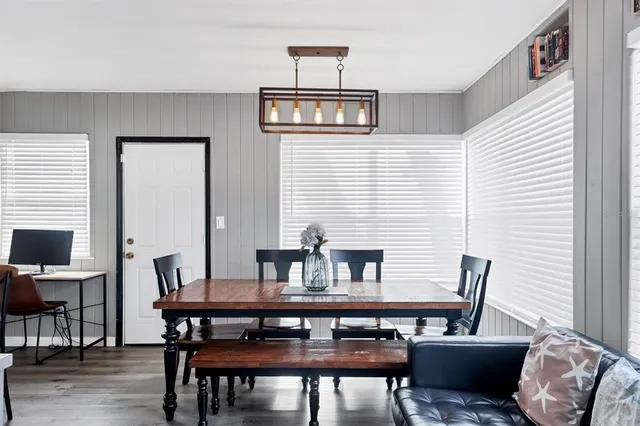 a view of a dining room with furniture and a window
