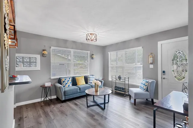 a living room with furniture and a large window
