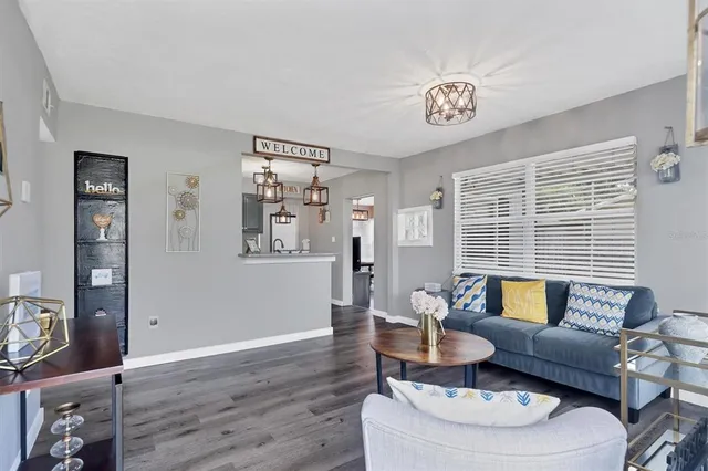 a living room with furniture and a table