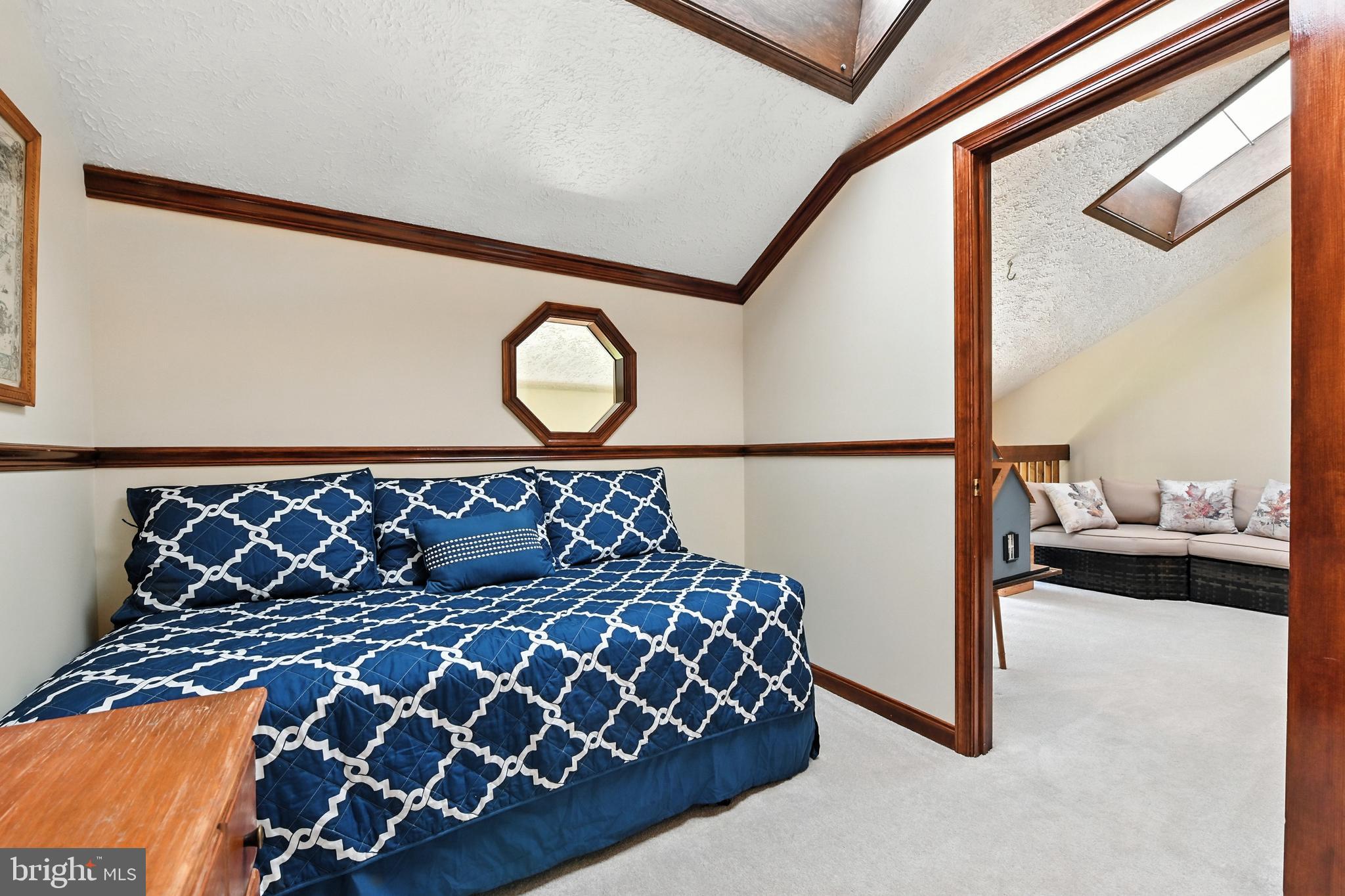 2520 Colonial Road Accokeek, MD 20607 - Photo 29 of 74 a bed sitting in a bedroom next to a window with lamp