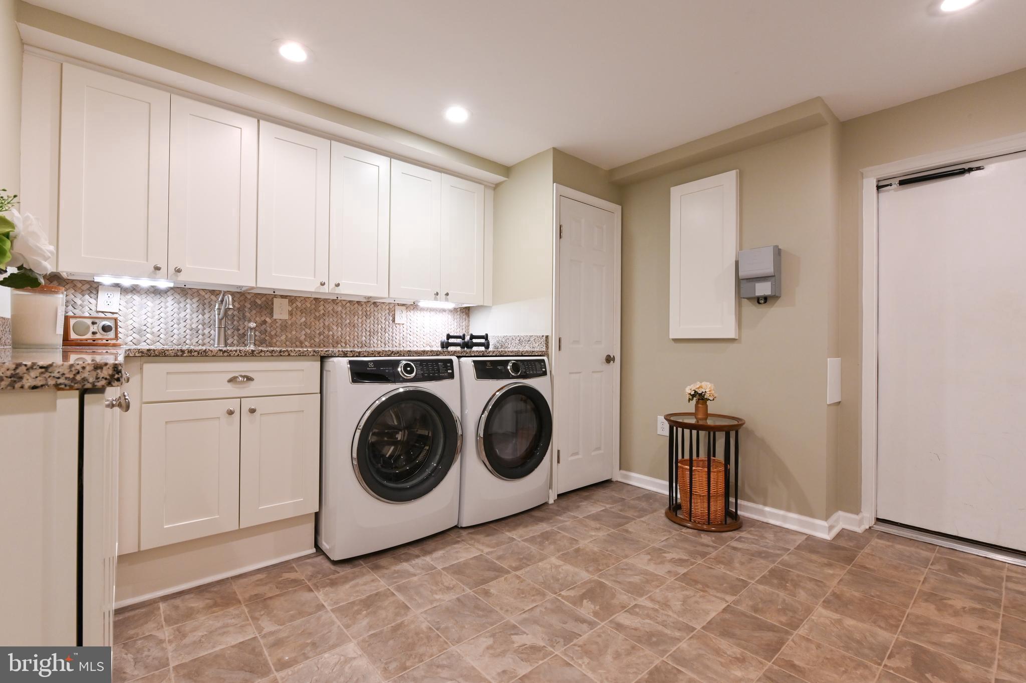 2520 Colonial Road Accokeek, MD 20607 - Photo 36 of 74 a utility room with sink dryer and washer
