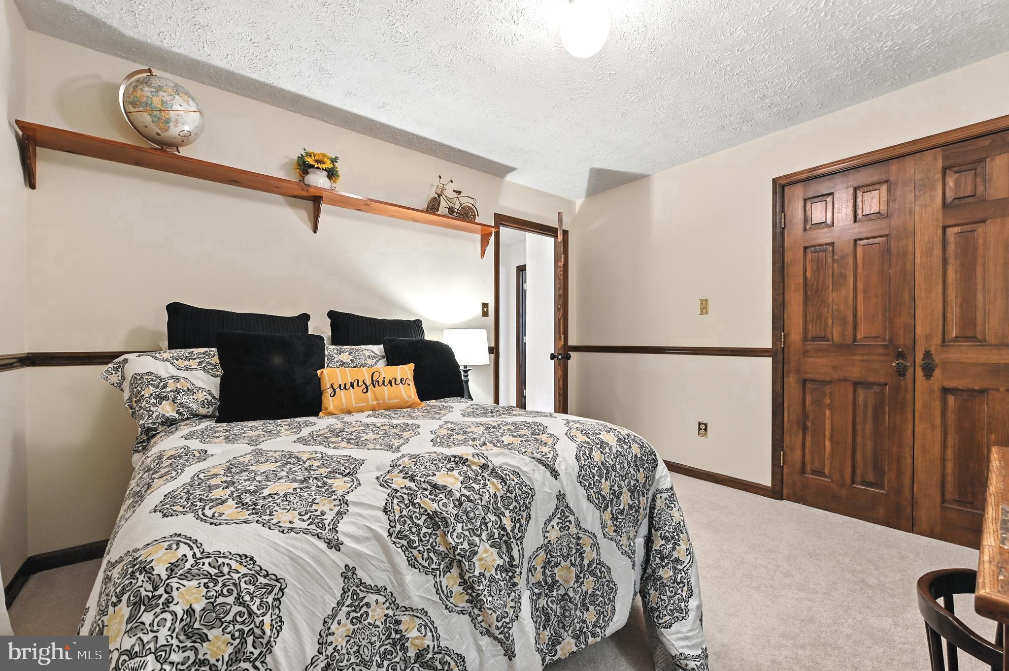 2520 Colonial Road Accokeek, MD 20607 - Photo 51 of 74 a bedroom with a bed and wooden floor
