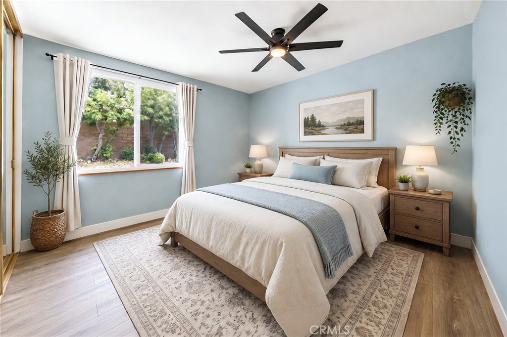 6296 Marble Avenue Rancho Cucamonga, CA 91701 - Photo 55 of 89 a bedroom with a large bed and a window