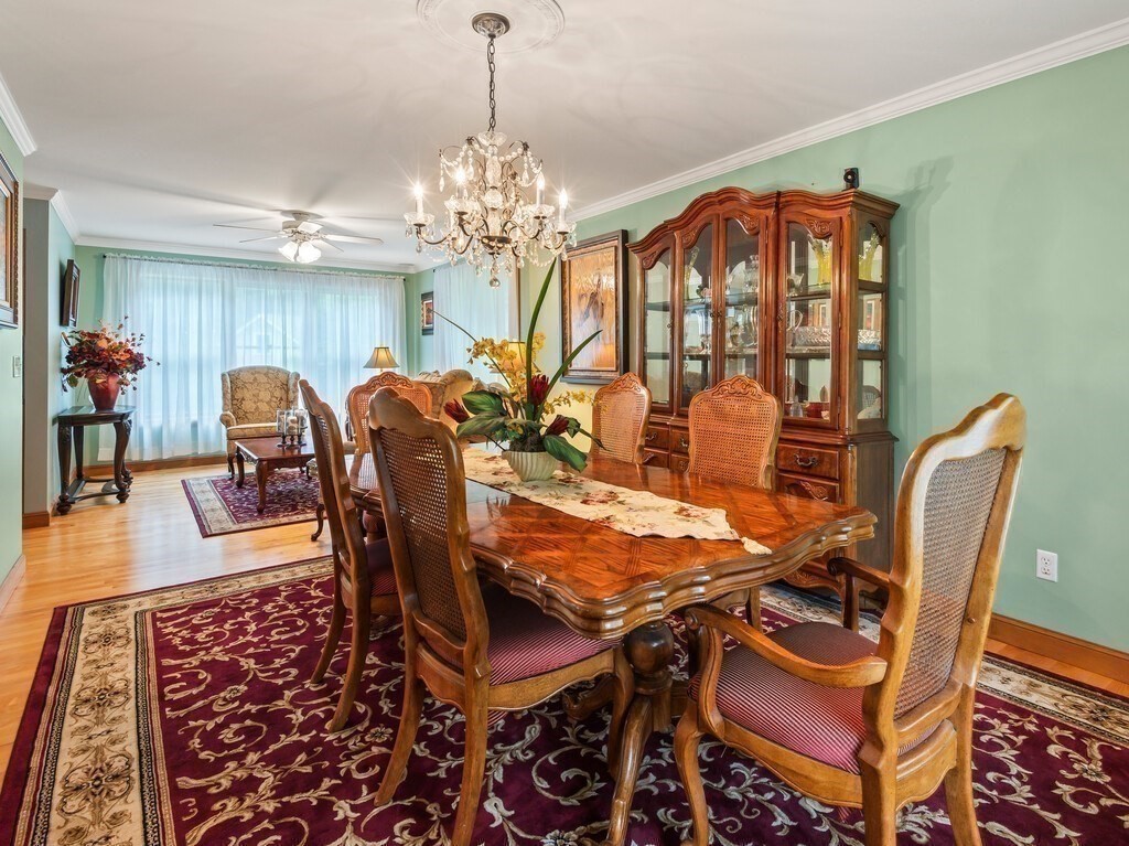 9 Santom Street Auburn, MA 01501 - Photo 14 of 42 a view of a dining room with furniture and chandelier