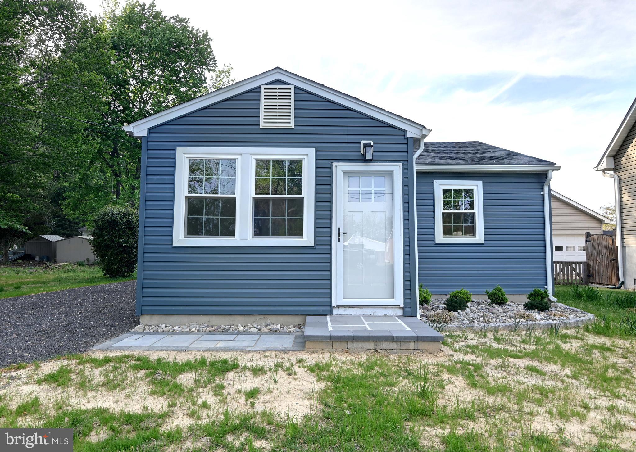 1616 Beech Road St. Leonard, MD 20685 - Photo 2 of 40 a front view of a house with garden
