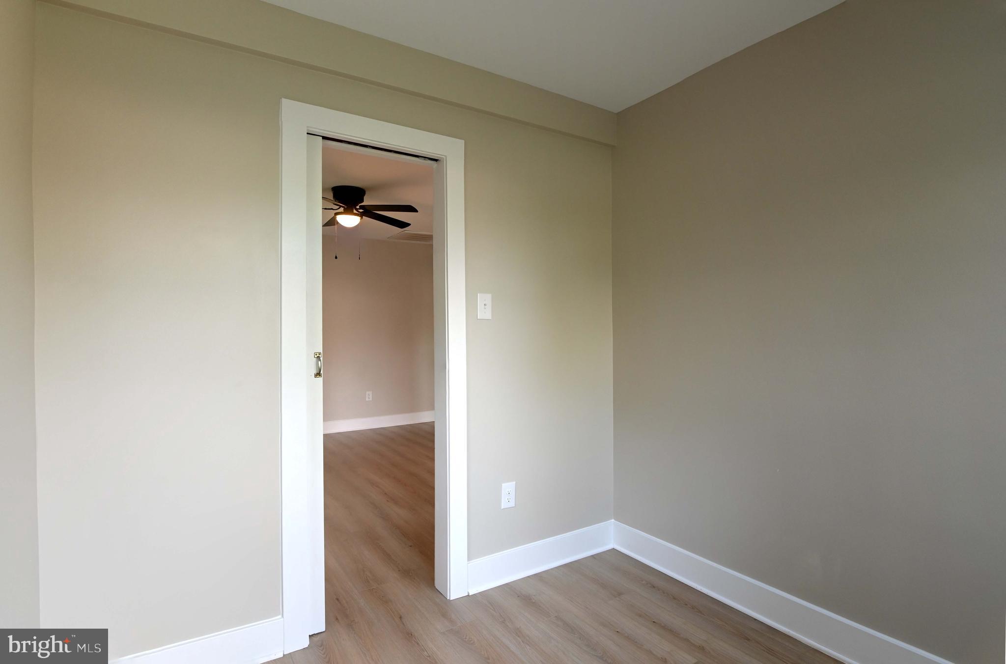 1616 Beech Road St. Leonard, MD 20685 - Photo 10 of 40 an empty room with wooden floor and closet