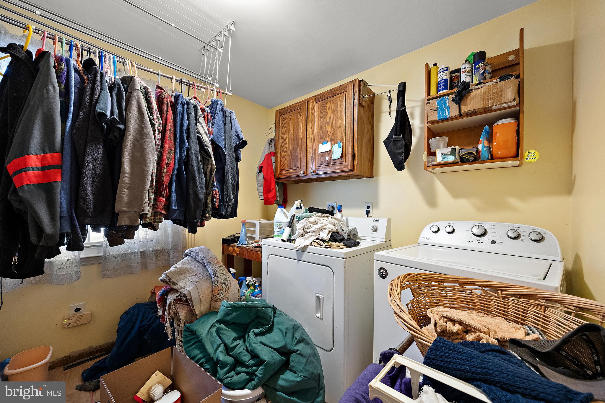 506 Cambridge Drive Newark, DE 19711 - Photo 12 of 38 a view of walk in closet with clothes and shoes