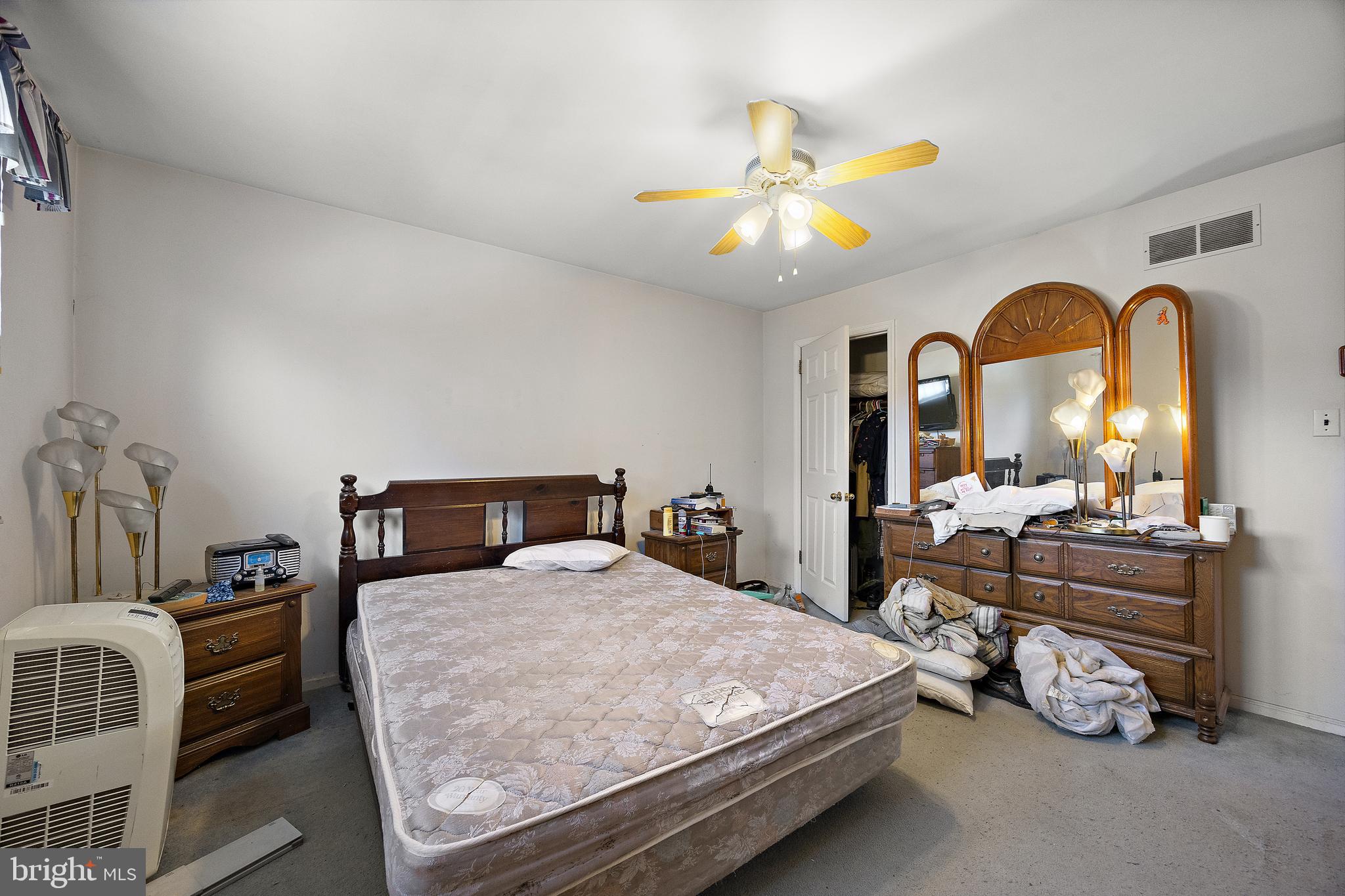 506 Cambridge Drive Newark, DE 19711 - Photo 15 of 38 a bedroom with a bed and ceiling fan