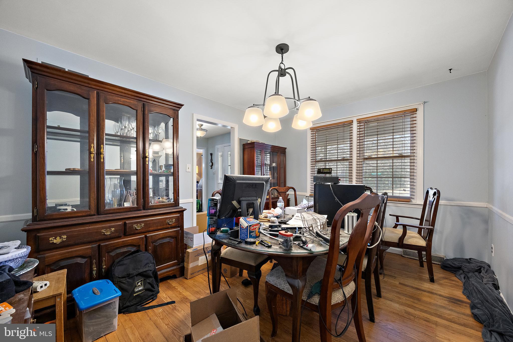 506 Cambridge Drive Newark, DE 19711 - Photo 4 of 38 a view of a dining room with furniture a chandelier and wooden floor