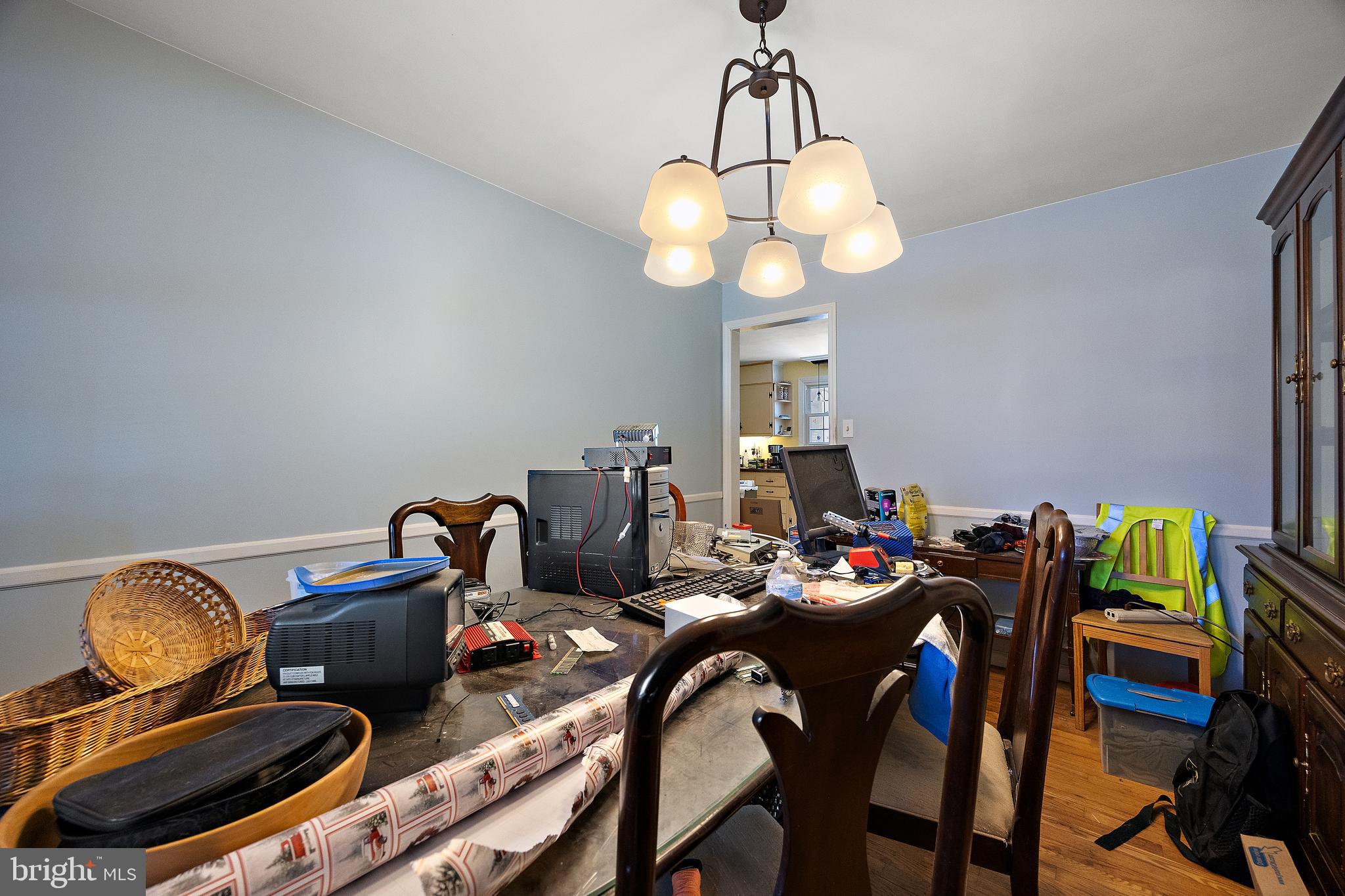 506 Cambridge Drive Newark, DE 19711 - Photo 5 of 38 a view of a dining room with furniture and chandelier