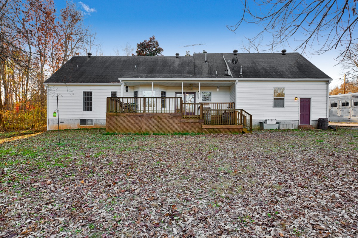 10722 Chestnut Ridge Road Lynchburg, TN 37352 - Photo 3 of 38 a front view of a house with garden
